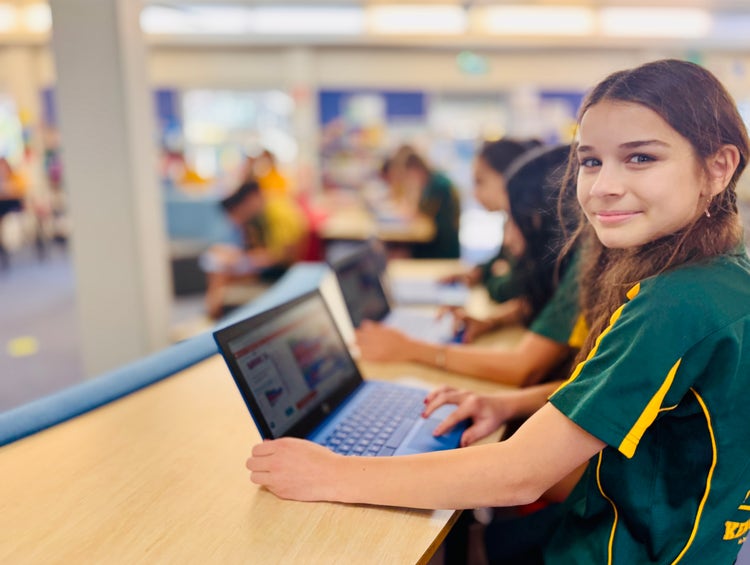 Student using a computer in the library