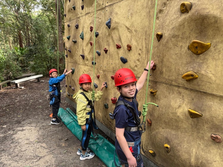 Students rock climbing at camp